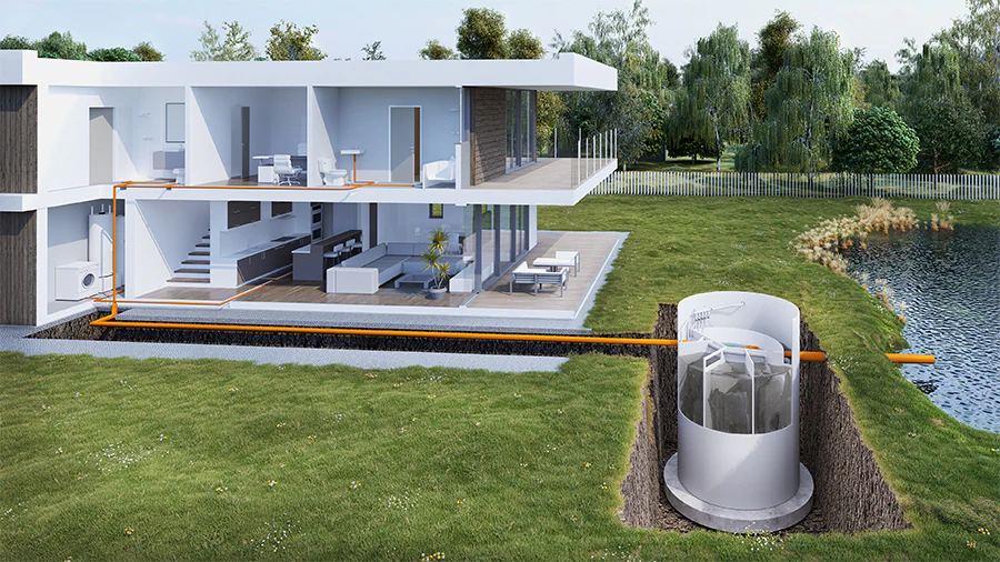 Galería 4 "Sistema moderno de depuración de aguas residuales instalado en una vivienda, con tuberías que conducen el agua a una planta de tratamiento avanzada junto a un cuerpo de agua natural."